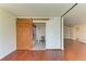 Bedroom with barn door leading to the ensuite bathroom and view to living space at 618 Bird Bay S Dr # 110, Venice, FL 34285
