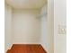 Walk-in closet with hardwood floors and wire shelving at 618 Bird Bay S Dr # 110, Venice, FL 34285