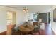 Bright living room featuring hardwood floors, stylish furniture, and access to outdoor space with lots of light at 618 Bird Bay S Dr # 110, Venice, FL 34285