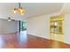 Bright living room with hardwood floors flowing into the kitchen area at 618 Bird Bay S Dr # 110, Venice, FL 34285