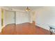 Spacious living room features hardwood floors and ample natural light at 618 Bird Bay S Dr # 110, Venice, FL 34285