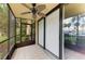 Inviting screened patio with a ceiling fan and sliding glass doors for easy indoor-outdoor living at 618 Bird Bay S Dr # 110, Venice, FL 34285