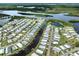Scenic aerial view of a coastal community with waterfront homes nestled along waterways near a vast lake at 700 Blackburn Blvd, North Port, FL 34287