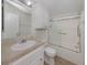 Clean bathroom featuring a shower with sliding glass doors and vanity storage at 700 Blackburn Blvd, North Port, FL 34287