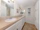 Spacious primary bathroom featuring dual sinks, tile floors, and ample cabinet storage at 700 Blackburn Blvd, North Port, FL 34287