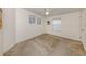 Cozy carpeted bedroom featuring a ceiling fan and a bright window at 700 Blackburn Blvd, North Port, FL 34287