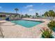 Community swimming pool with well-kept patio and blue water at Harbor Cove at 700 Blackburn Blvd, North Port, FL 34287