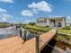 Waterfront home showcasing a private dock, with canal access, in a charming, coastal community at 700 Blackburn Blvd, North Port, FL 34287