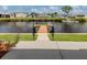 Waterfront home access featuring a private dock with easy access to the canal for boating and recreation at 700 Blackburn Blvd, North Port, FL 34287