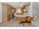 Cozy kitchen featuring ample storage, stainless steel refrigerator and eat-in counter with seating at 700 Blackburn Blvd, North Port, FL 34287