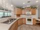 Bright kitchen offering modern appliances, countertop space, and tiled floors for easy cleanup at 700 Blackburn Blvd, North Port, FL 34287