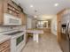 Open concept kitchen features eat-in table space and flows into the dining area at 700 Blackburn Blvd, North Port, FL 34287
