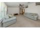 Spacious living room featuring plush seating, neutral tones, and soft natural light at 700 Blackburn Blvd, North Port, FL 34287