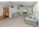 Comfortable living room with open access to dining and kitchen featuring plush seating at 700 Blackburn Blvd, North Port, FL 34287
