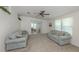 Spacious living area featuring plush carpeting, soft lighting, and a sliding glass door at 700 Blackburn Blvd, North Port, FL 34287