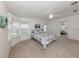 Large main bedroom features natural lighting, ceiling fan, and a mirrored closet at 700 Blackburn Blvd, North Port, FL 34287