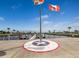 Harbor Cove waterfront view with Canadian and Florida flags waving in the breeze at 700 Blackburn Blvd, North Port, FL 34287