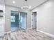 Bright dining area featuring new flooring, modern lighting, and easy access to the kitchen at 7140 Teaberry St, Englewood, FL 34224
