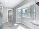 Bright kitchen nook with a bay window and gray tile flooring at 7140 Teaberry St, Englewood, FL 34224