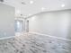 Open-concept living room with modern flooring, recessed lighting, and a seamless flow at 7140 Teaberry St, Englewood, FL 34224