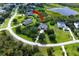 View of home with an arrow showing its location near a pond at 8209 Snowy Egret Pl, Bradenton, FL 34202