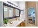 Bright bathroom with a single sink vanity and a shower-tub combo with tile surround at 8209 Snowy Egret Pl, Bradenton, FL 34202