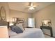 Inviting bedroom with a comfortable bed, neutral decor, and carpet flooring, creating a relaxing retreat at 8209 Snowy Egret Pl, Bradenton, FL 34202