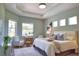 Bright bedroom with many windows, ceiling detail, and neutral decor at 8209 Snowy Egret Pl, Bradenton, FL 34202