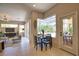 Lovely dining area with seating for four features a breakfast nook and is adjacent to the living room and outdoor patio at 8209 Snowy Egret Pl, Bradenton, FL 34202