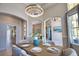 Dining room boasts a modern chandelier and flows seamlessly into other living spaces at 8209 Snowy Egret Pl, Bradenton, FL 34202