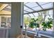 Exterior view from the main bedroom to pool and landscaped backyard at 8209 Snowy Egret Pl, Bradenton, FL 34202