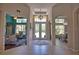 Welcoming foyer with tile floors, a decorative chandelier, and views into the living and dining areas at 8209 Snowy Egret Pl, Bradenton, FL 34202