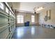 Spacious garage with finished floor, large windows, and overhead door at 8209 Snowy Egret Pl, Bradenton, FL 34202