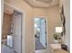 Hallway featuring entryways to bathroom and bedroom at 8209 Snowy Egret Pl, Bradenton, FL 34202
