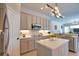Well-lit kitchen featuring stylish cabinets, stainless steel appliances, and a functional center island at 8209 Snowy Egret Pl, Bradenton, FL 34202