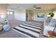 Large living room featuring comfortable seating, plush carpeting, and bright lighting at 8209 Snowy Egret Pl, Bradenton, FL 34202