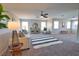 Spacious living room with plush carpet, modern decor, and ample natural light at 8209 Snowy Egret Pl, Bradenton, FL 34202