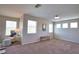 Well-lit living room with comfortable seating, bright windows, and modern decor at 8209 Snowy Egret Pl, Bradenton, FL 34202