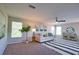 Bright living room with a neutral color scheme, stylish furniture, and large windows at 8209 Snowy Egret Pl, Bradenton, FL 34202