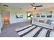 Inviting living room featuring plush carpet, cozy seating, and stylish decor at 8209 Snowy Egret Pl, Bradenton, FL 34202