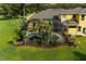 View of a screened-in pool and lush landscaping at 8209 Snowy Egret Pl, Bradenton, FL 34202