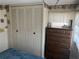 Bedroom featuring a closet and dresser at 834 Cervina S Dr, Venice, FL 34285
