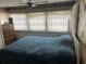 Bedroom with a bed, ceiling fan, and a window at 834 Cervina S Dr, Venice, FL 34285