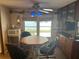 Cozy dining area with wood table, sea themed accents, and built-in cabinets at 834 Cervina S Dr, Venice, FL 34285