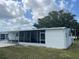 View of the side and rear of a single-story home with covered parking at 834 Cervina S Dr, Venice, FL 34285
