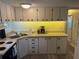 Functional kitchen with white cabinets, ample counter space, and modern sink at 834 Cervina S Dr, Venice, FL 34285