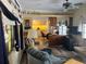 Inviting living room featuring nautical decor, wood-look flooring, and a comfortable seating area at 834 Cervina S Dr, Venice, FL 34285