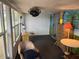 Cozy living room featuring bright walls, large windows, and a desk at 834 Cervina S Dr, Venice, FL 34285