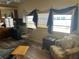 Relaxing living room featuring comfortable seating and large windows at 834 Cervina S Dr, Venice, FL 34285