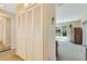 Bedroom view featuring closet space and water view through sunny windows at 838 Carnoustie Dr, Venice, FL 34293